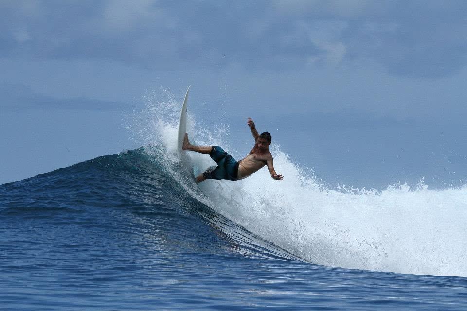 Kevin throwing his board around in a turn off the top